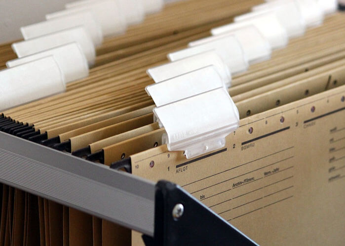 An image of a filing system that serves as the featured image of what is a title search in Florida. 