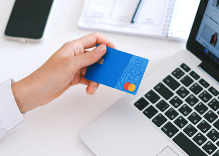 An image of a woman making an online payment that is the featured image of who pays for title insurance in Florida.