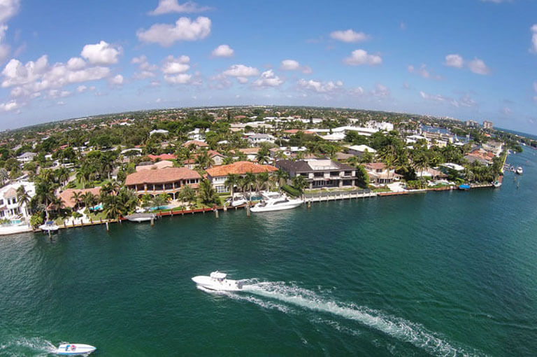 An image of South Florida waterfront real estate, used as the featured image of why use ASR Law Firm Title Services.