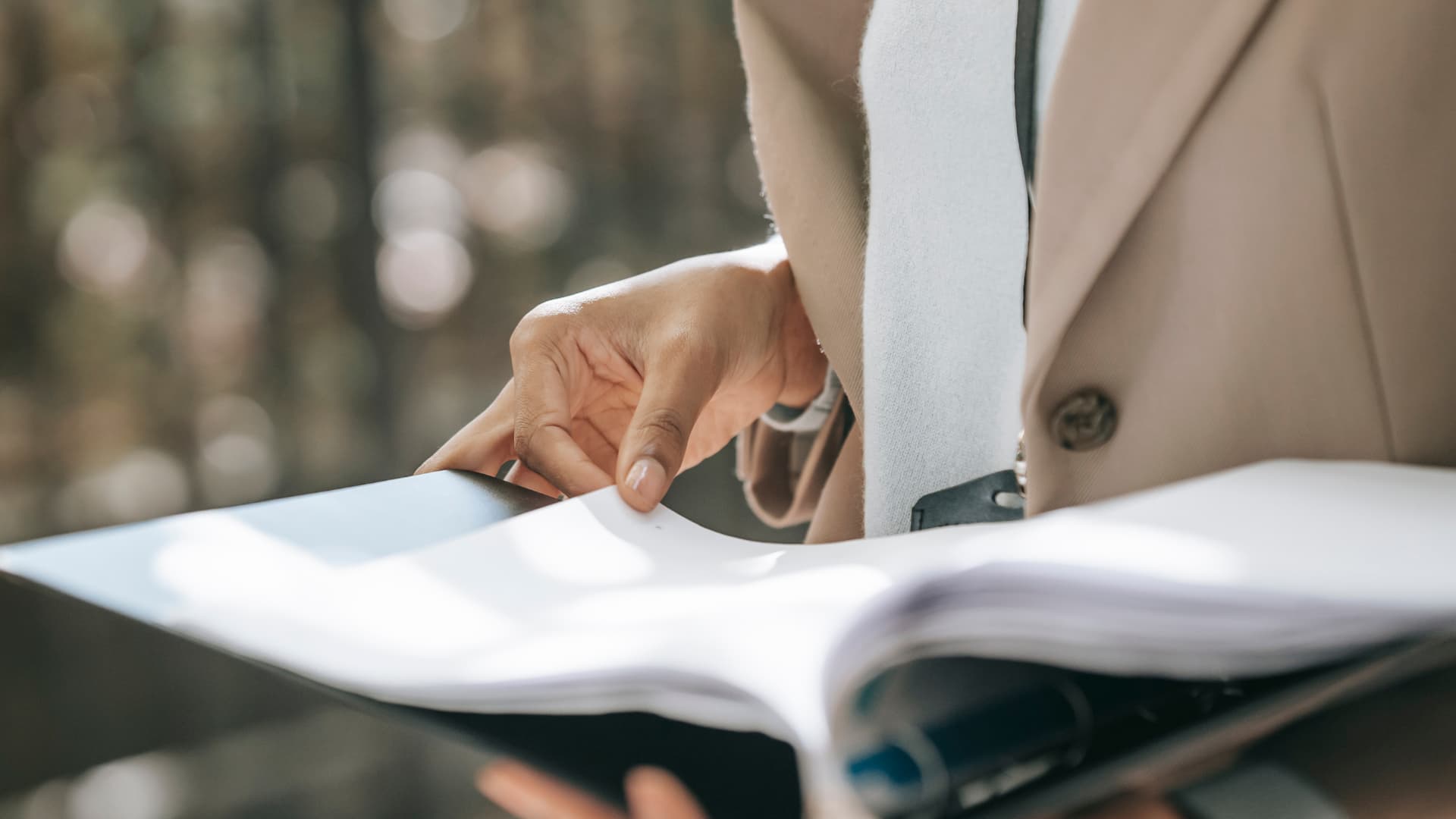 An image of an attorney going over Florida Annual Reporting documents in a law office. 