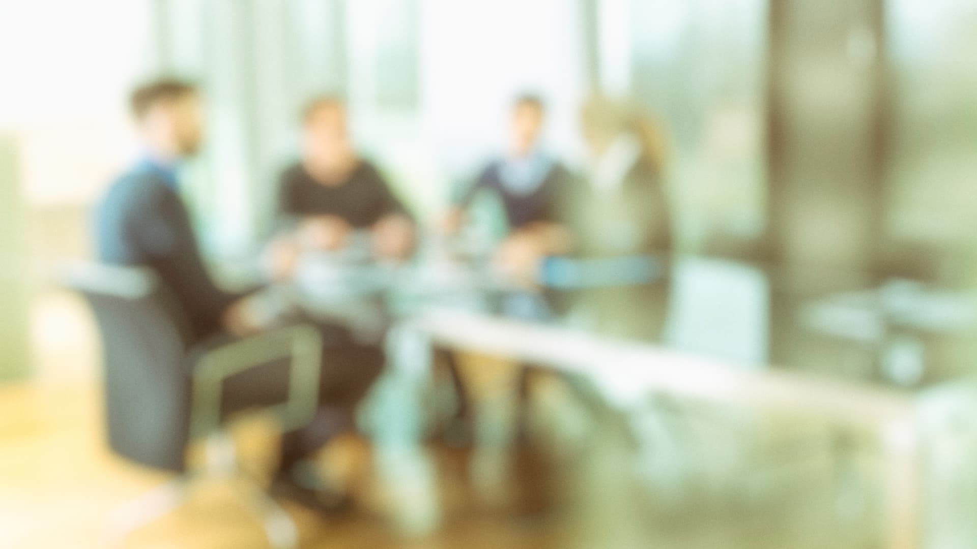 An image of a corporate title company in Florida at a meeting desk. 