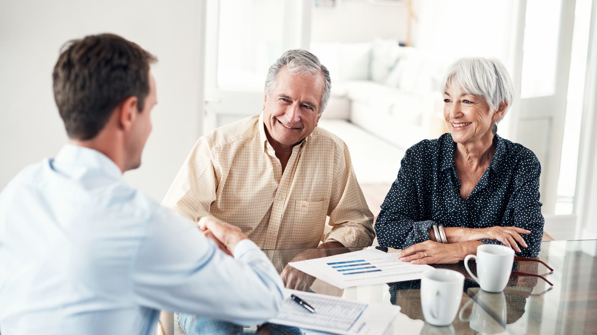 An image of an older couple meeting with an estate planning attorney.