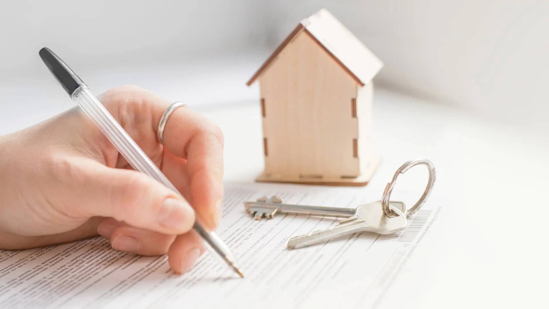 An image of a realtor with deed documents.