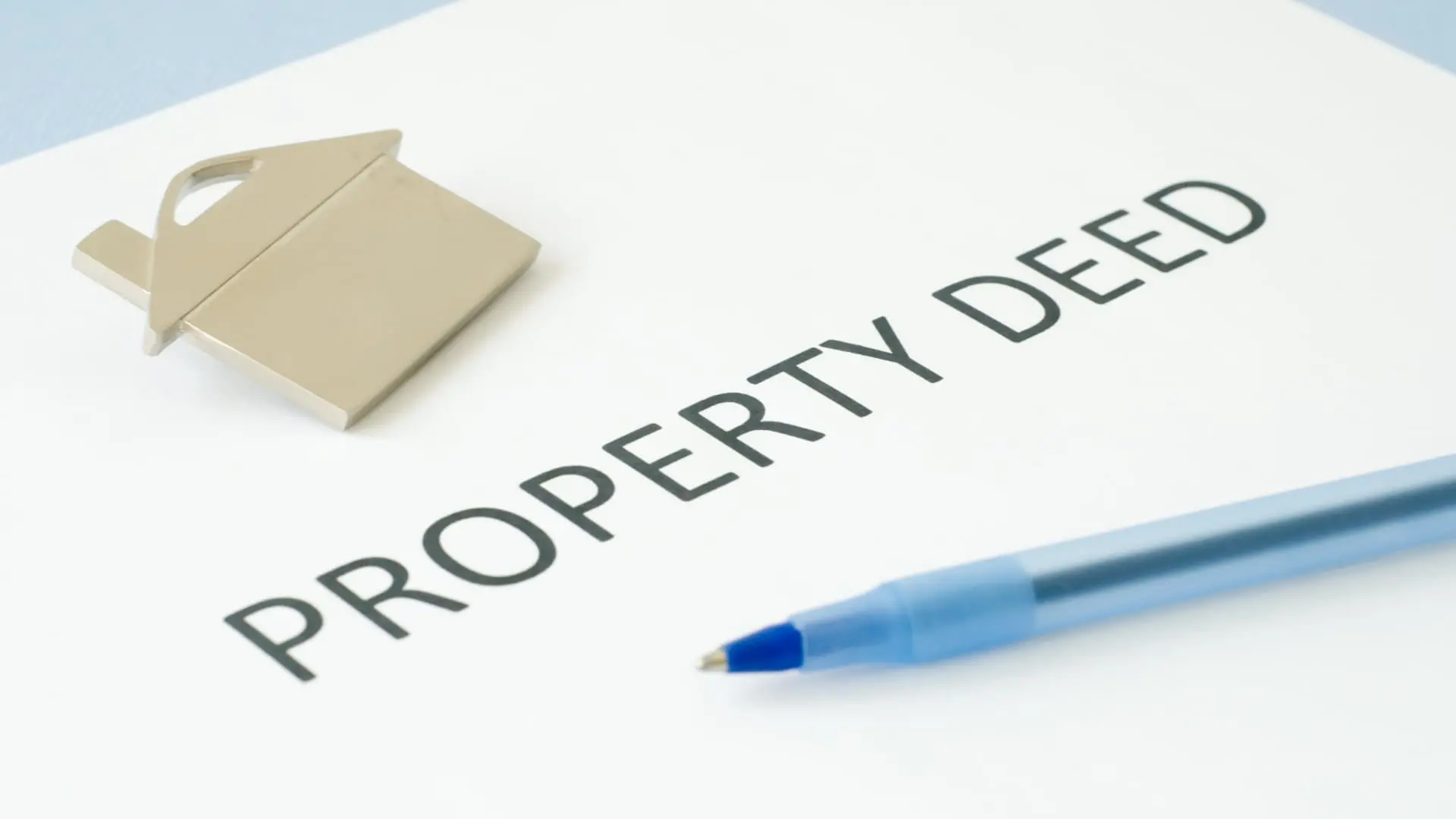 An image of a property pin on a property document. 