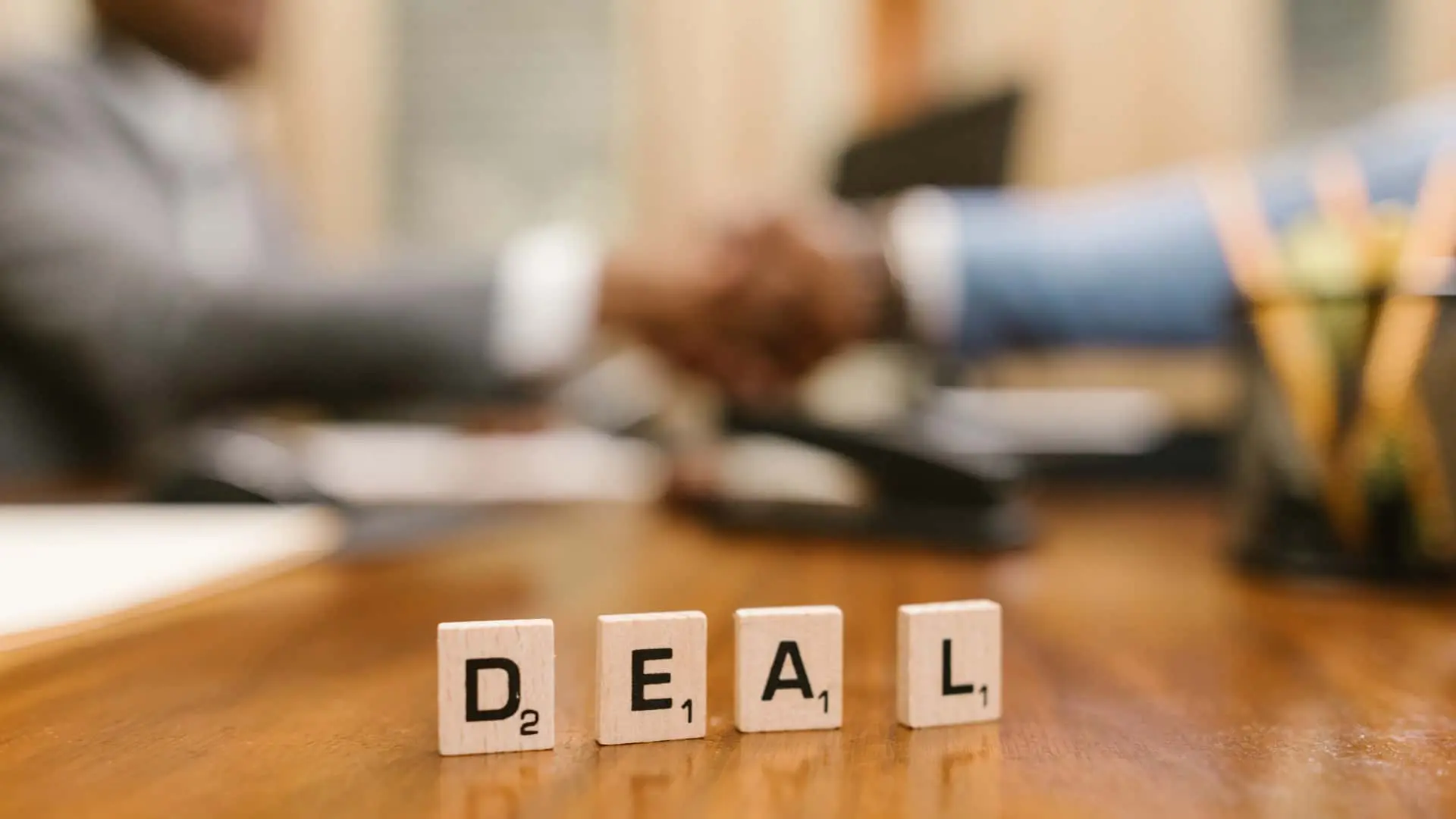 An image of word tiles spelling out Deal for for sale by owner properties. 