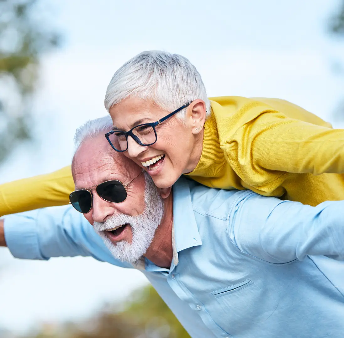 An image of an older couple celebrating together after avoiding probate. 