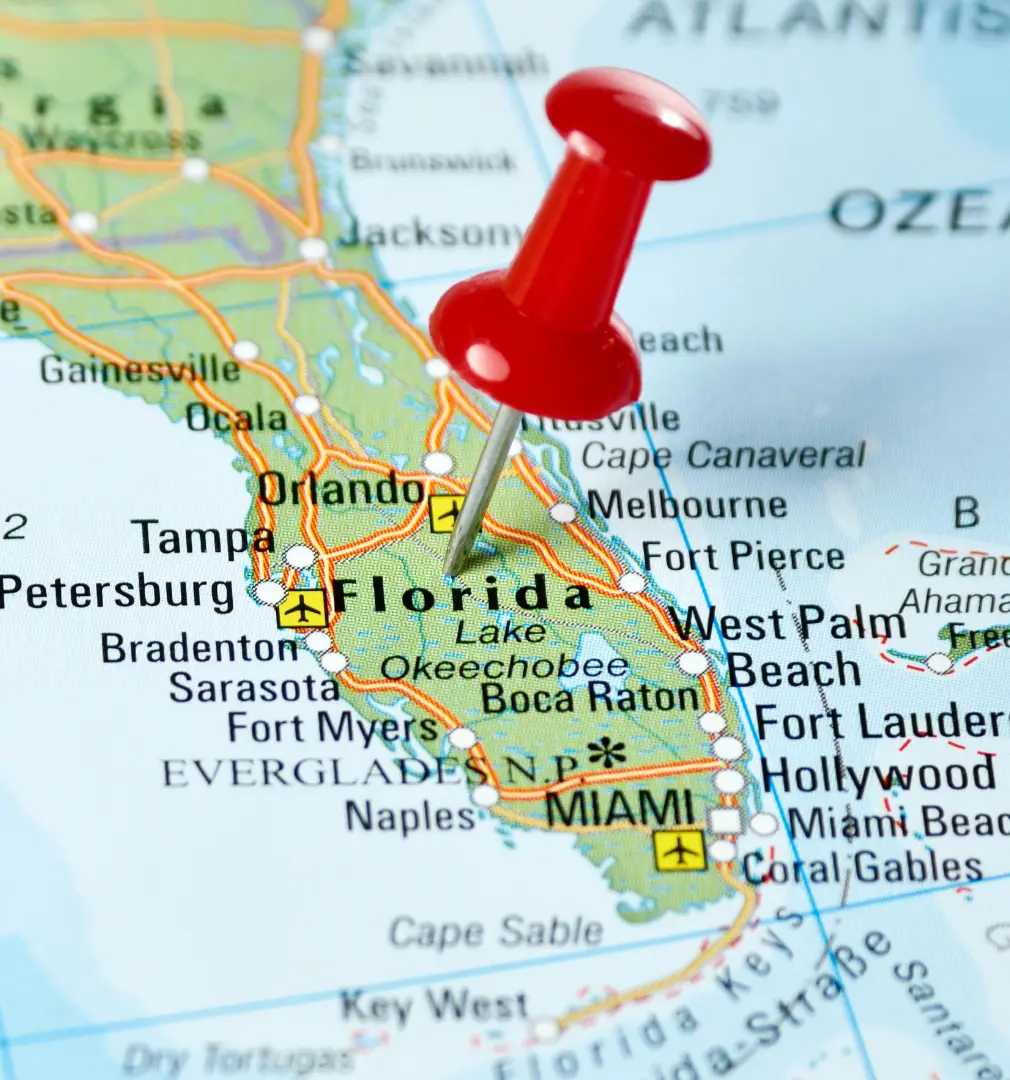 An image of a map of the state of florida with a pin in it.