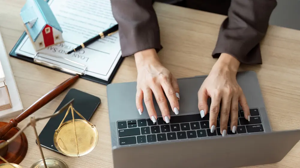An image of a woman attorney conducting a virtual consultation. 