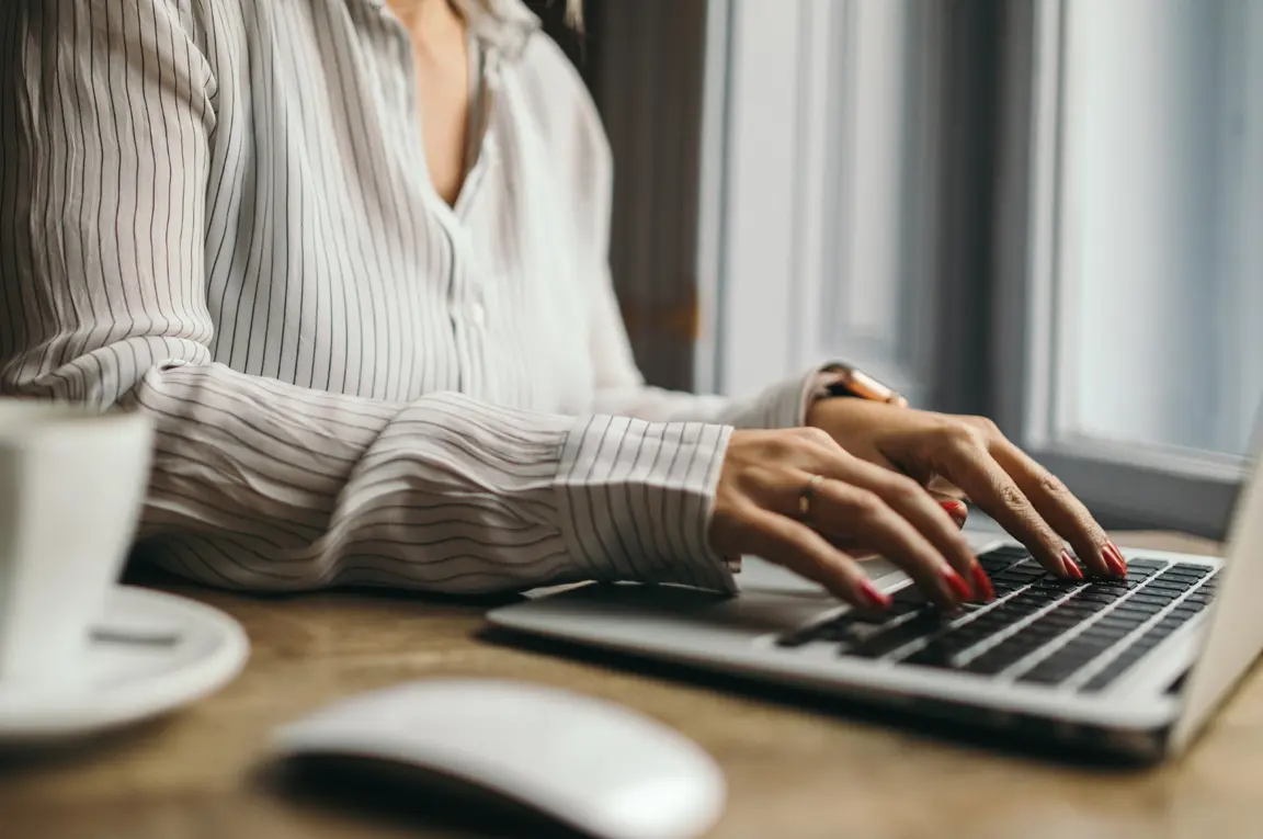 An image of an attorney at a desk having a virtual legal consultation with a client. 