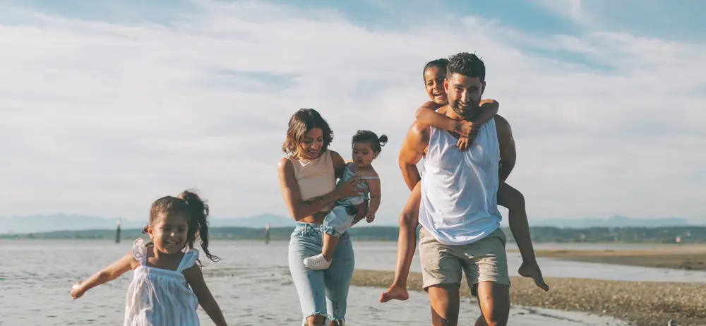 An image of a family on a beach that represents the comprehensive Estate Planning services at ASR Law Firm. 