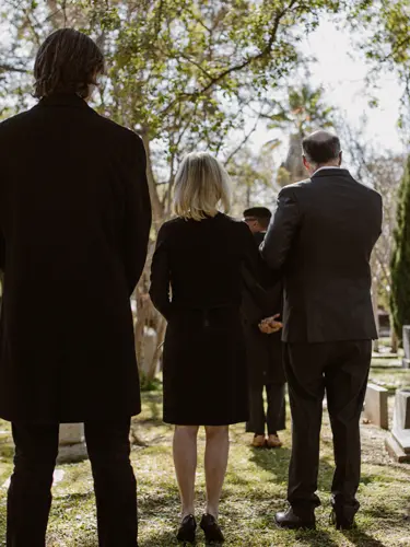 An image of people at a funeral showing the importance of probate attorney services in Florida