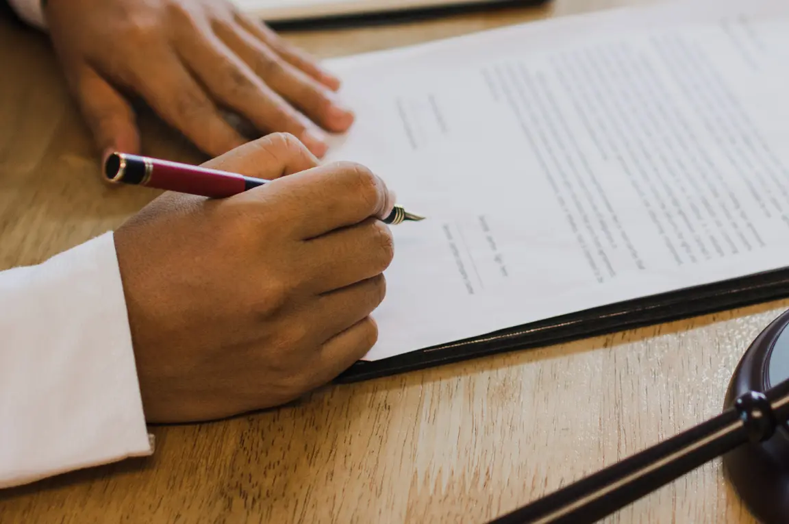 An image of a florida probate lawyer signing documents related to the Florida Probate Matter. 