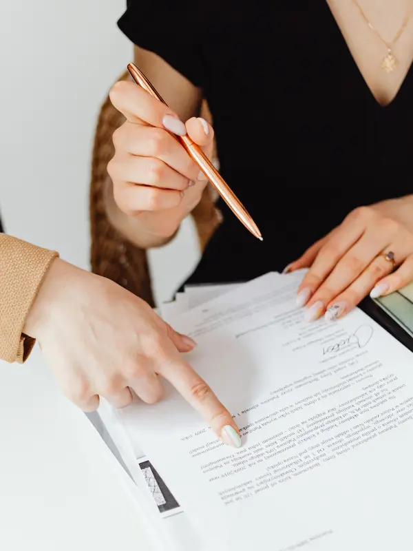 An image of people going through probate looking over probate documents with their attorney. 