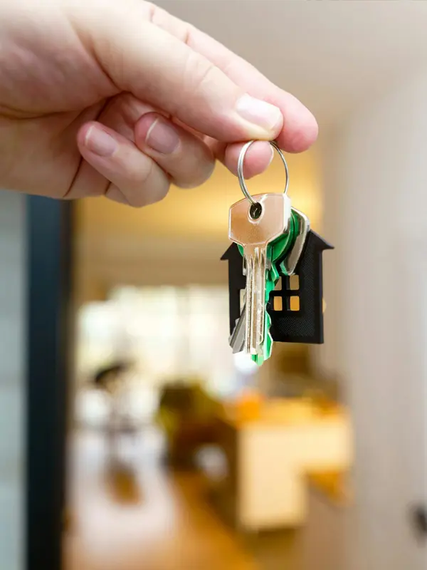 An image of a real estate agent handing over keys after successful real estate contract review with ASR Law Firm of Florida. 