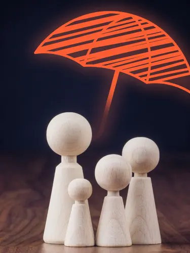A graphic of a family being protected by an insurance umbrella. 