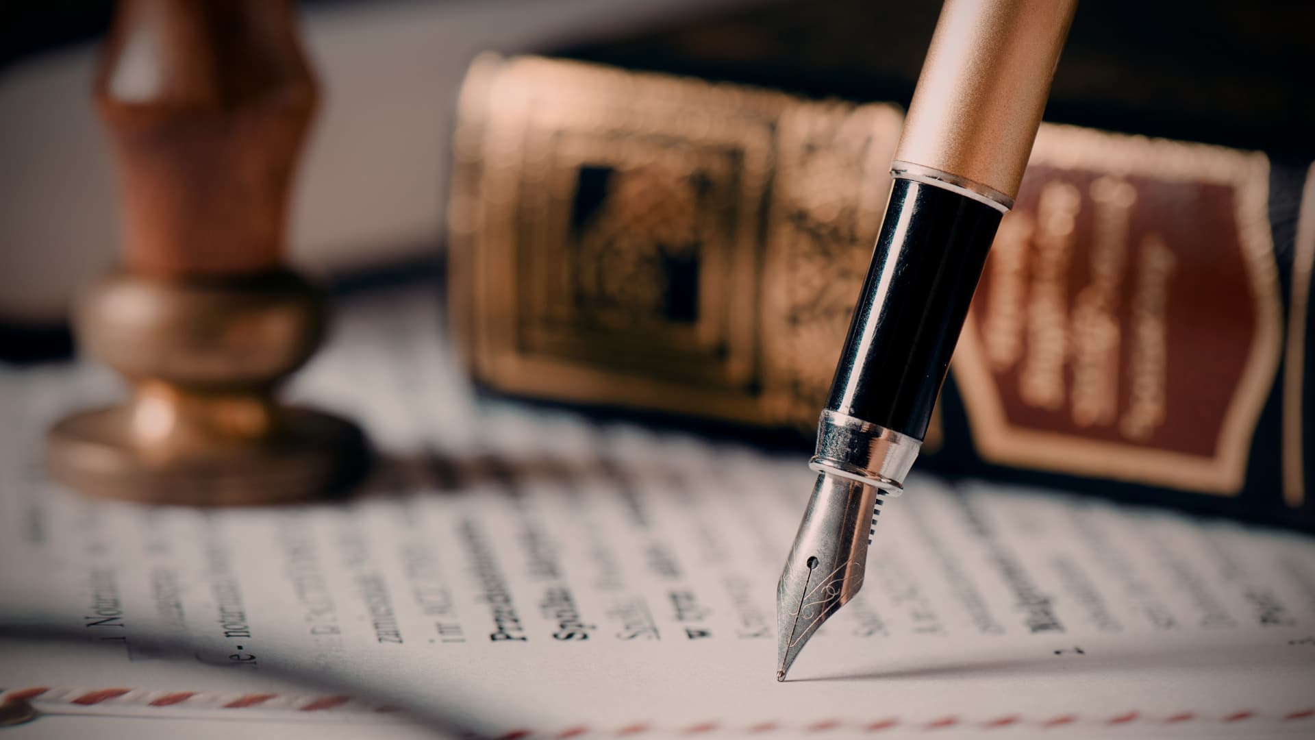An image of a fountain pen on a document that shows the approval of trademark process for business owners. 