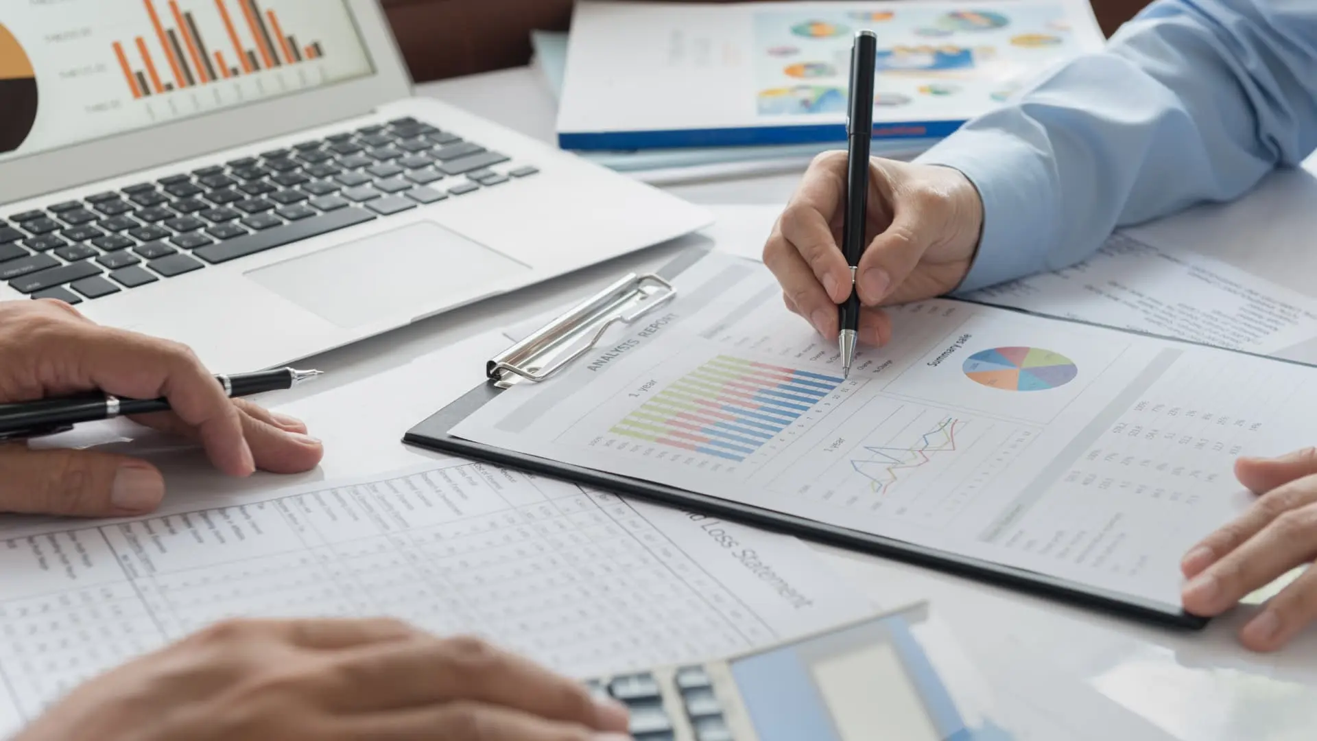 An image of people going over assets and finances that is the featured image for the Article 10 Assets peopple forget go through probate process in flroida by asr law firm. 