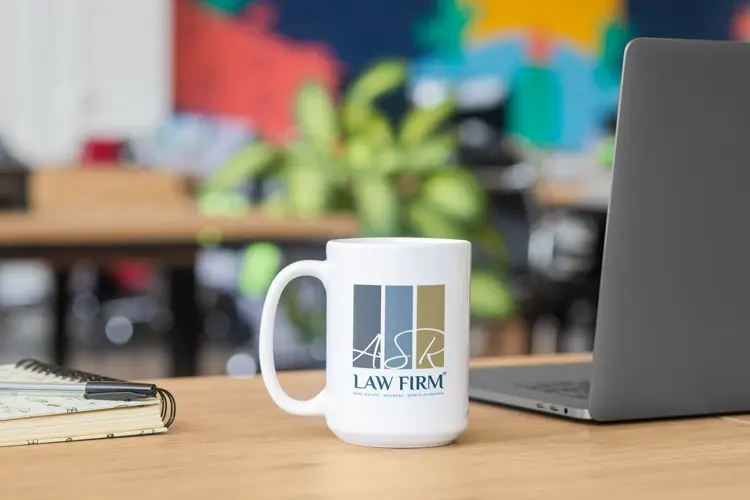 ASR Law Firm — Boca Raton Estate Planning Office ASR Law Firm branded coffee mug on a desk, representing personalized Lady Bird Deed and estate planning guidance for Boca Raton homeowners